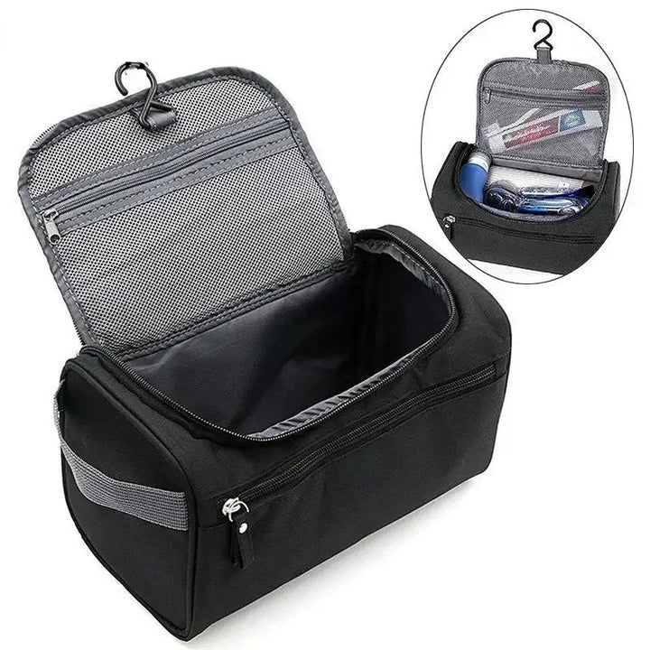 Borsa da toilette nera aperta con gancio, tasche a rete e scomparti per articoli da viaggio. Organizzatore compatto per cosmetici e accessori.