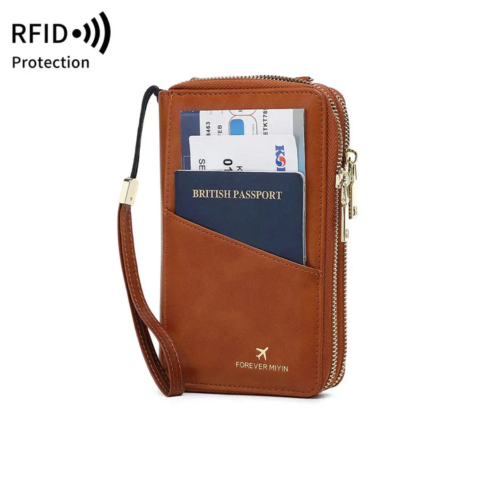 Portafoglio da viaggio in pelle marrone con protezione RFID, scomparti per passaporto, carte di credito e contanti, chiusura a zip, design compatto.
