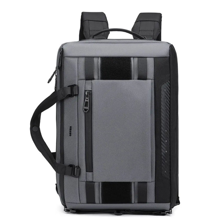 Zaino da viaggio grigio e nero, design moderno, tasca frontale con zip, manico laterale, spallacci imbottiti. Ideale per lavoro e tempo libero.