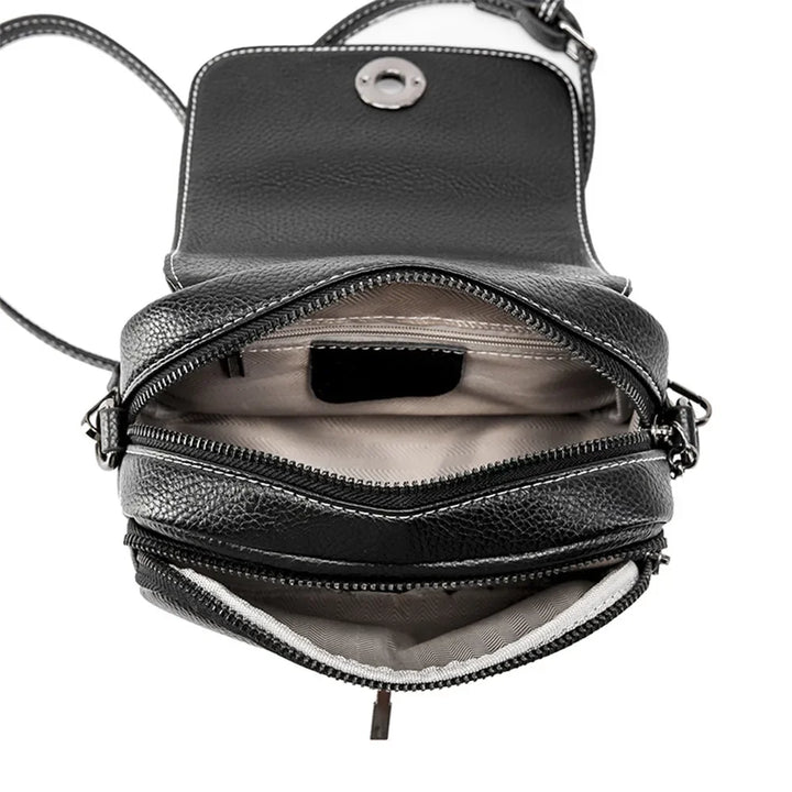 Borsa a tracolla in pelle nera con cerniere multiple, design compatto, ideale per donna. Interno spazioso, perfetta per uso quotidiano.