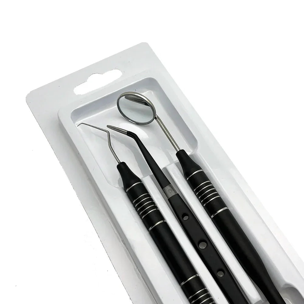 Set di strumenti dentali in acciaio inox, specchietto, sonda e scaler, confezione blister, strumenti per igiene orale professionale.