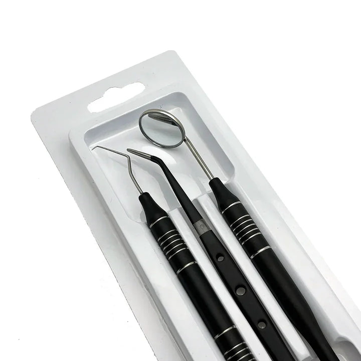 Set di strumenti dentali in acciaio inox, specchietto, sonda e scaler, confezione blister, strumenti per igiene orale professionale.