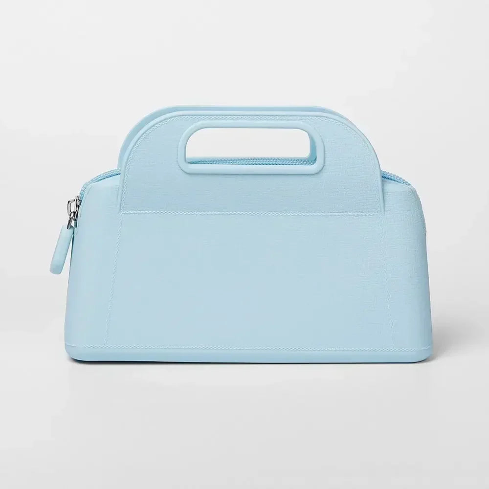 Borsa a mano in pelle azzurra con manico integrato, design elegante e moderno, ideale per moda femminile e accessori di lusso.