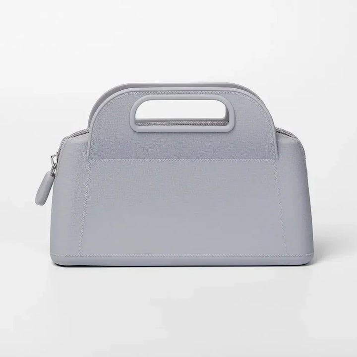 Borsa a mano grigia in pelle, design elegante e moderno, chiusura con zip, manico integrato. Accessorio moda donna, stile minimalista.