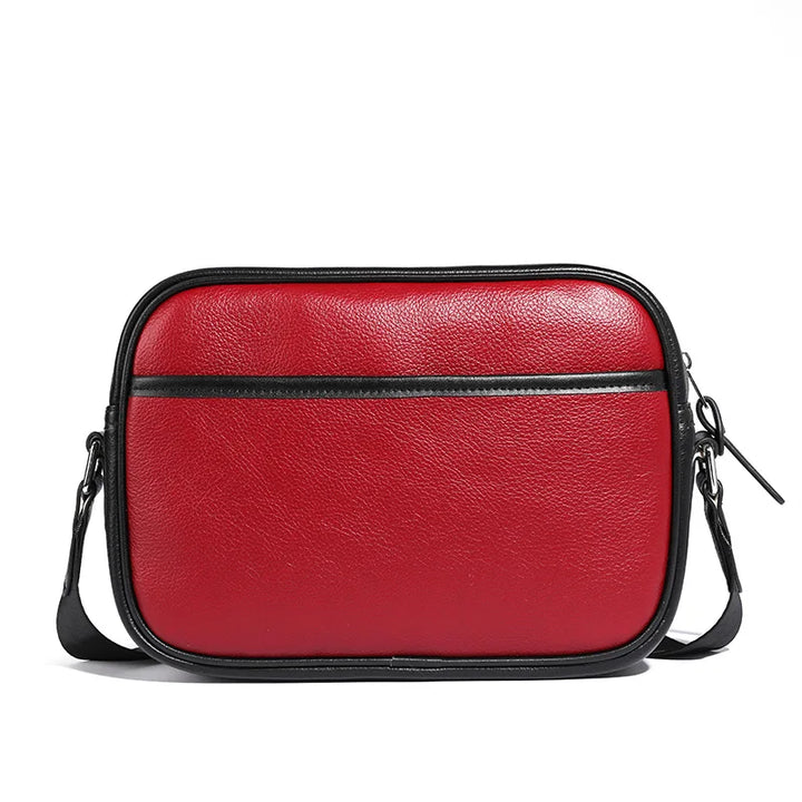 Borsa a tracolla in pelle rossa, design elegante con cerniera nera, ideale per moda donna, accessorio versatile e di tendenza.