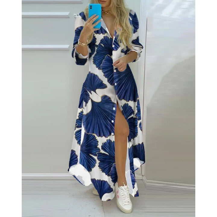 Abito lungo donna bianco con stampa floreale blu, maniche lunghe, abbottonato, stile casual elegante, perfetto per primavera estate.