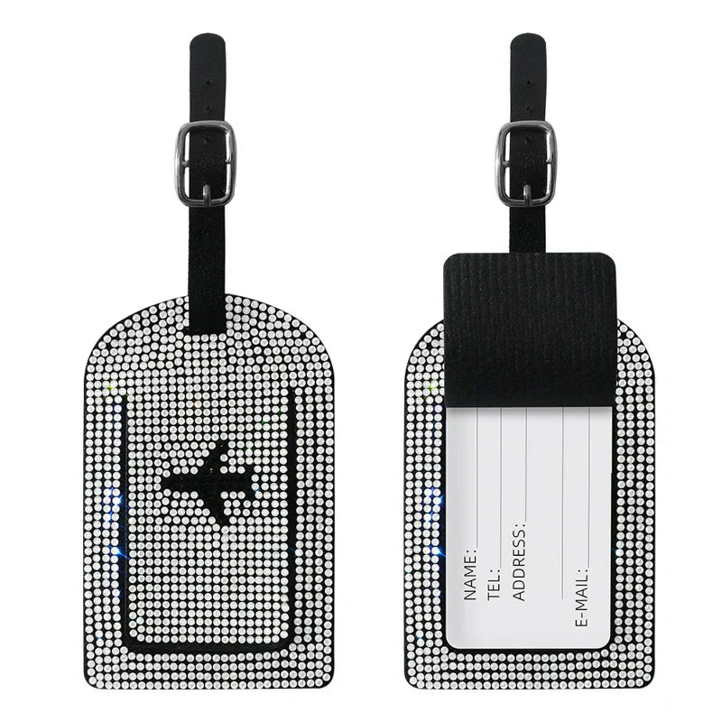 Etichette bagaglio con strass, design aereo, nero e argento, con fibbia regolabile. Accessorio viaggio elegante e funzionale per valigie.
