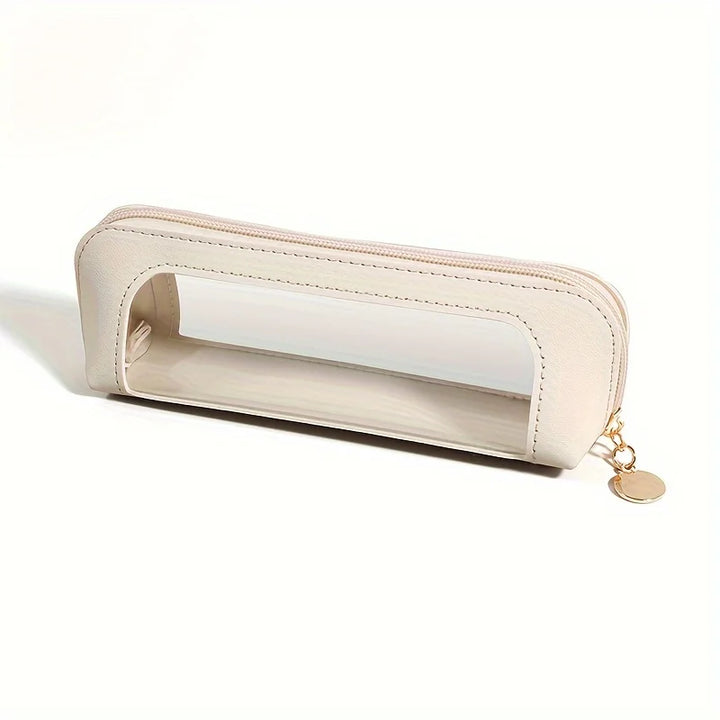 Astuccio trasparente in pelle beige con cerniera dorata, design elegante e moderno, ideale per scuola e ufficio. Accessorio pratico e alla moda.