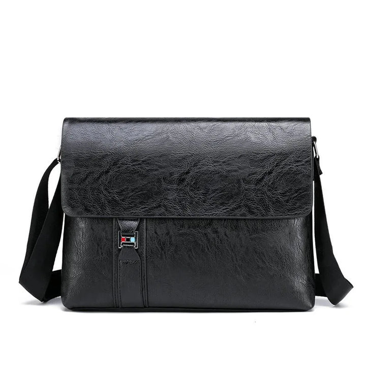Borsa a tracolla in pelle nera elegante, design moderno, chiusura a fibbia, ideale per lavoro e viaggio. Accessorio moda uomo/donna.