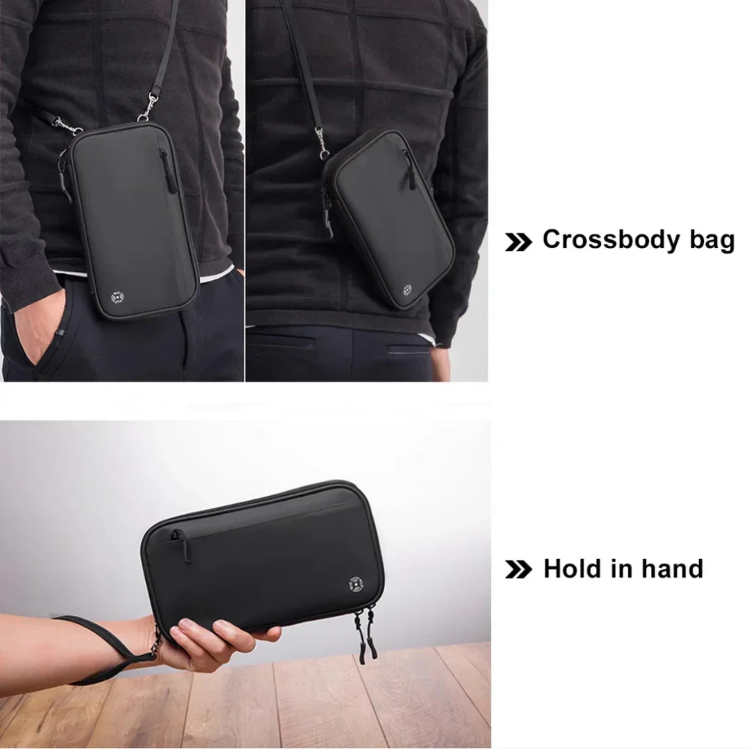 Borsa a tracolla nera unisex, compatta e moderna, con cerniera, ideale per viaggi e uso quotidiano. Design versatile, portatile a mano o a tracolla.