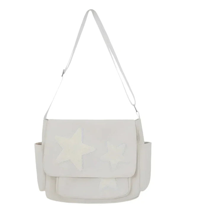 Borsa a tracolla bianca con stelle, design elegante, tasche laterali, perfetta per moda donna. Accessorio versatile e trendy.