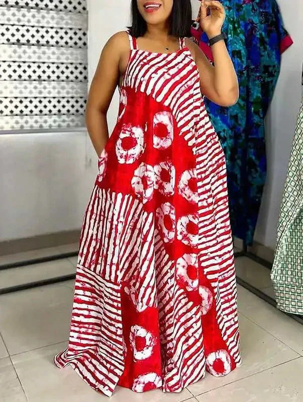 Abito lungo estivo da donna in tessuto batik rosso e bianco, design a righe e cerchi, senza maniche, ideale per moda casual e vacanze.