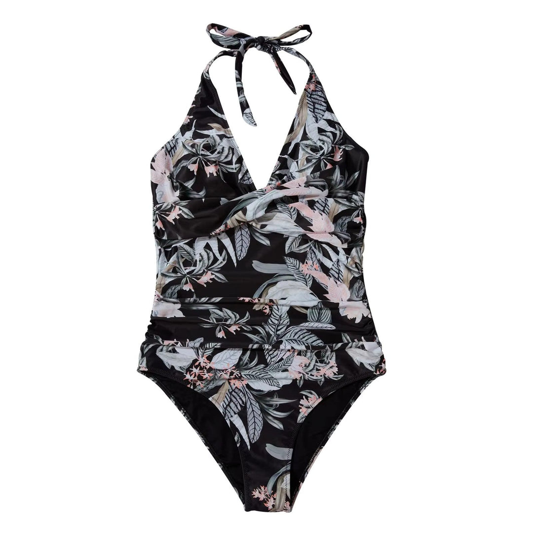 Costume intero donna nero con stampa floreale tropicale, scollo a V, allacciatura al collo. Elegante e ideale per la spiaggia o piscina.