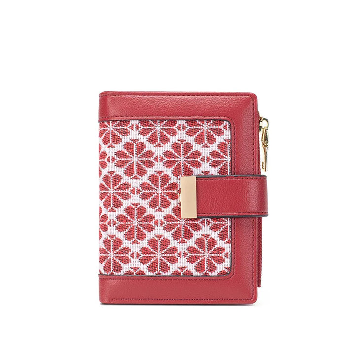 Portafoglio donna rosso in pelle con motivo geometrico bianco e rosso, chiusura a zip dorata, design elegante e compatto. Accessorio moda femminile.