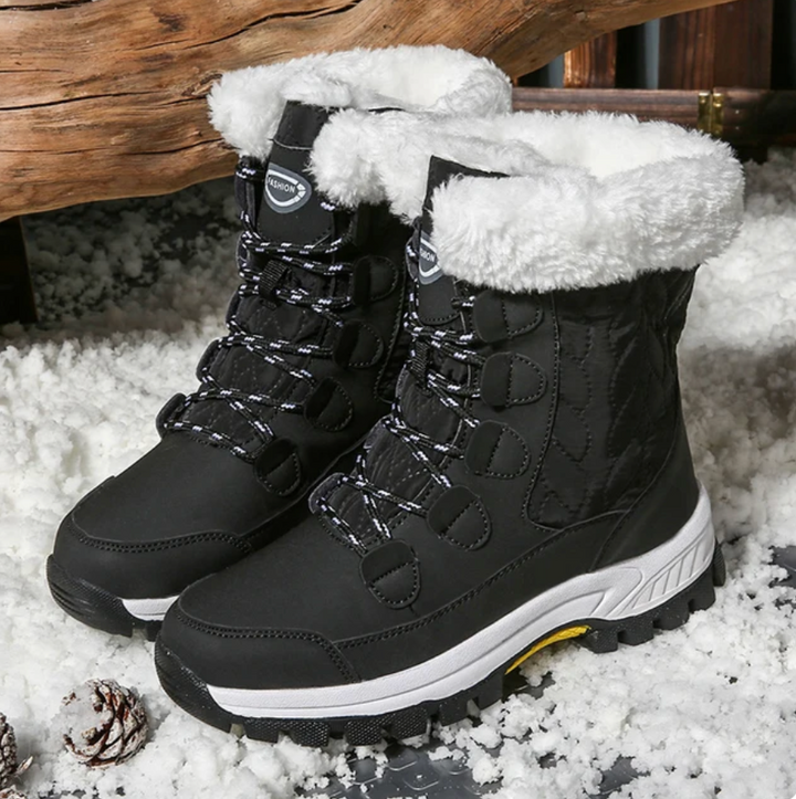 Stivali invernali neri da donna con fodera in pelliccia bianca, suola antiscivolo, ideali per neve e freddo. Design robusto e confortevole.