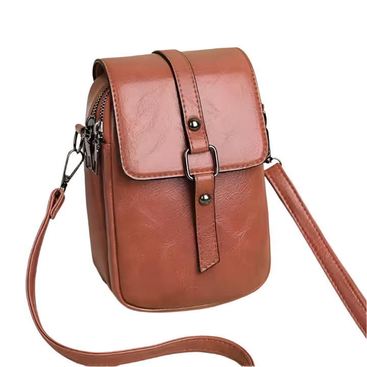 Borsa a tracolla in pelle marrone, design compatto con chiusura a fibbia, ideale per donna, moda autunno, accessorio elegante e pratico.