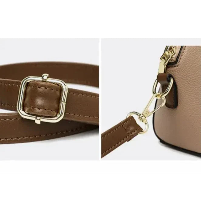 Cintura in pelle marrone con fibbia dorata e dettaglio di moschettone su borsa beige. Accessori moda eleganti, alta qualità, stile classico.