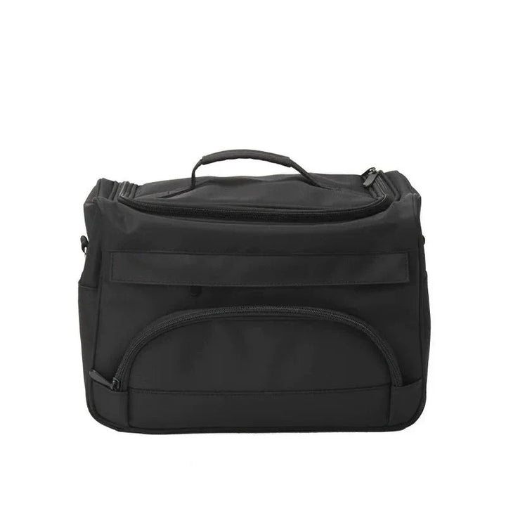 Borsa termica nera con manico, tasche multiple e chiusura a zip. Ideale per picnic, viaggi e conservazione alimenti. Design compatto e resistente.