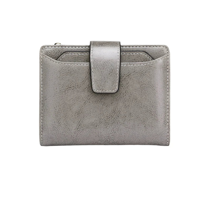 Portafoglio in pelle grigia con chiusura a bottone, design compatto, ideale per uomo e donna. Accessorio elegante e funzionale per ogni occasione.