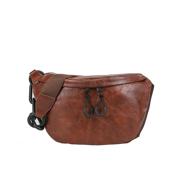 Marsupio in pelle marrone vintage, design elegante con cerniere nere, ideale per moda uomo e donna, accessorio versatile e pratico.
