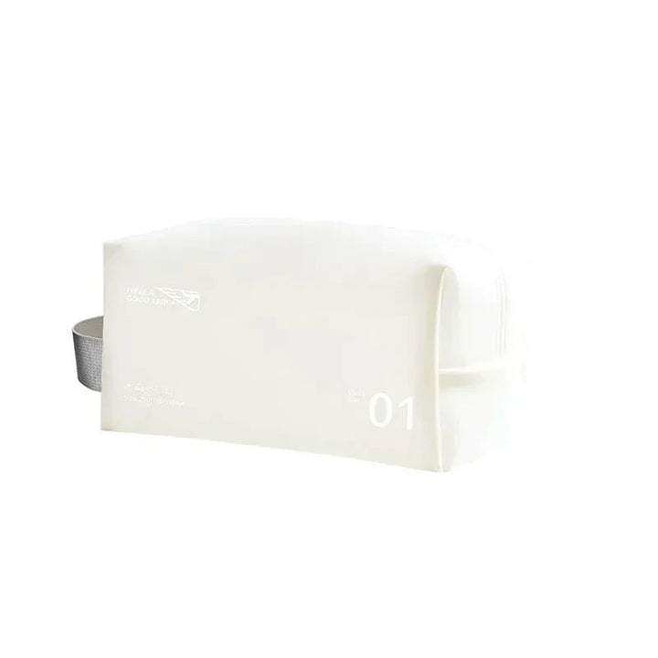 Astuccio da viaggio bianco minimalista con cerniera, design elegante e manico laterale. Ideale per cosmetici e accessori.