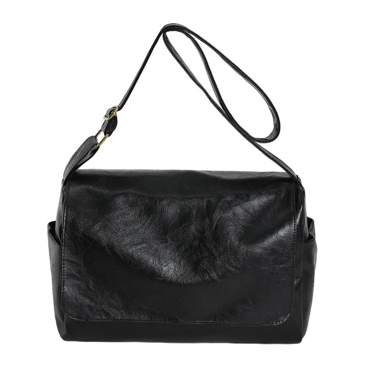 Borsa a tracolla in pelle nera, design elegante e moderno, ideale per donna. Accessorio moda versatile, perfetto per ogni occasione.