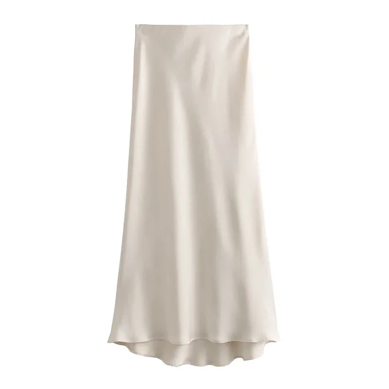 Gonna lunga in raso beige, elegante e fluida, perfetta per occasioni formali e casual. Tessuto lucido, design minimalista. Moda donna.