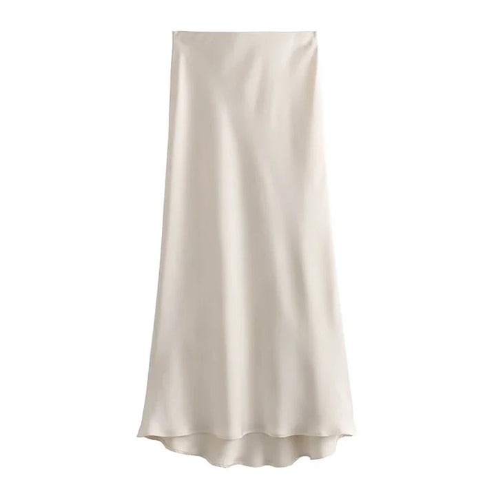 Gonna lunga in raso beige, elegante e fluida, perfetta per occasioni formali e casual. Tessuto lucido, design minimalista. Moda donna.
