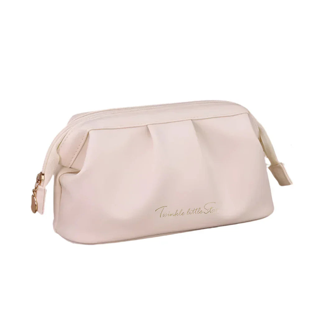 Astuccio cosmetico beige in pelle sintetica con cerniera dorata, design elegante e scritta "Twinkle little Star". Accessorio moda donna.