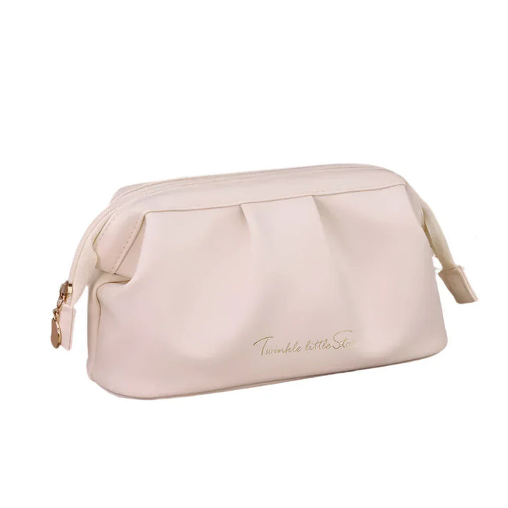 Astuccio cosmetico beige in pelle sintetica con cerniera dorata, design elegante e scritta "Twinkle little Star". Accessorio moda donna.