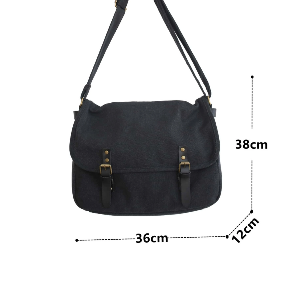 Borsa a tracolla nera in tela, dimensioni 38x36x12 cm, con fibbie decorative. Accessorio moda unisex, ideale per lavoro e tempo libero.