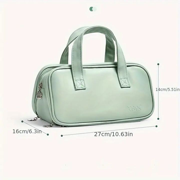 Borsa a mano verde menta in pelle sintetica, dimensioni 27x16x14 cm, con doppio manico e cerniera. Elegante e pratica per uso quotidiano.