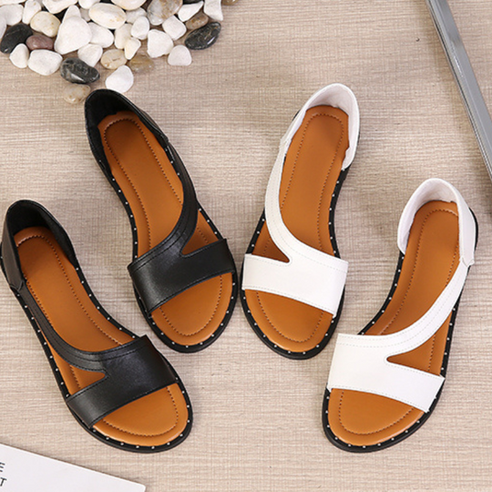 Sandali estivi da donna in pelle nera e bianca, design aperto, suola antiscivolo, ideali per moda casual e comfort quotidiano.