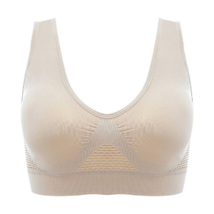 Reggiseno sportivo beige senza cuciture, design a rete traspirante, supporto confortevole, ideale per attività sportive e fitness.