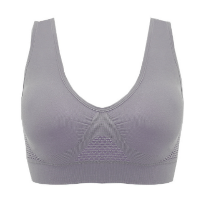 Reggiseno sportivo grigio senza cuciture, design a V, tessuto traspirante, supporto medio, ideale per fitness e yoga.