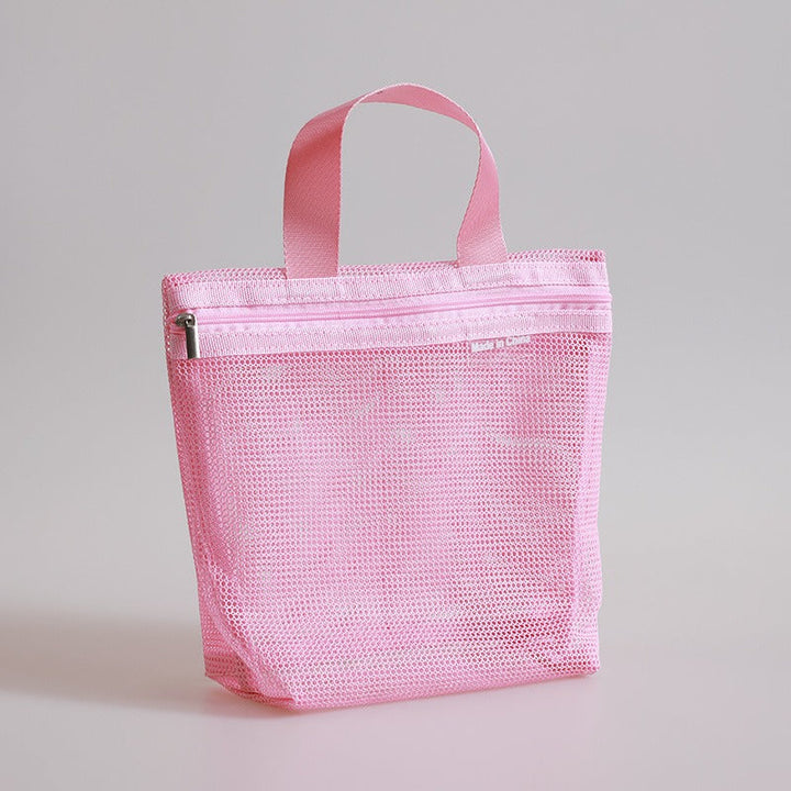 Borsa organizer rosa in rete con cerniera, ideale per viaggi e cosmetici. Design compatto e leggero, perfetto per organizzare accessori personali.