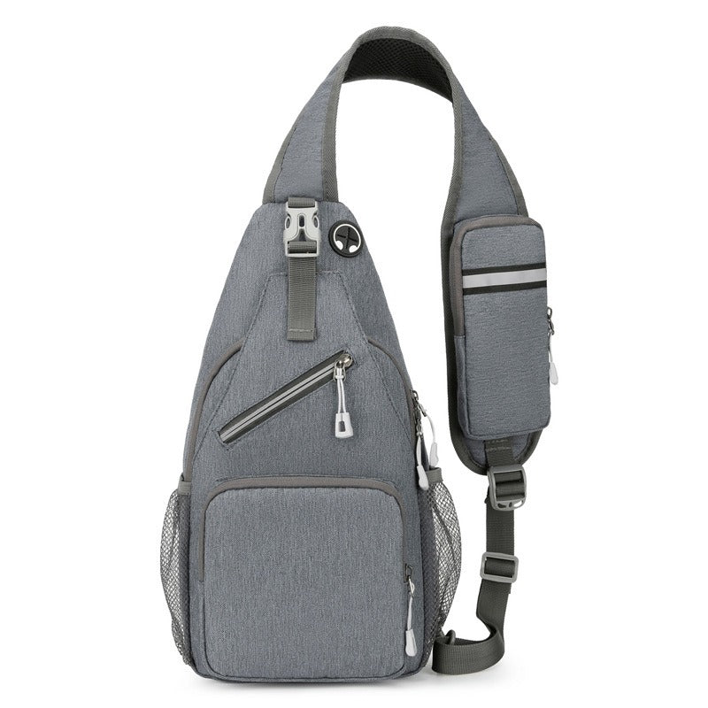 Zaino monospalla grigio con tasche multiple, design moderno e compatto, ideale per viaggi e attività all'aperto. Tasche laterali in rete.