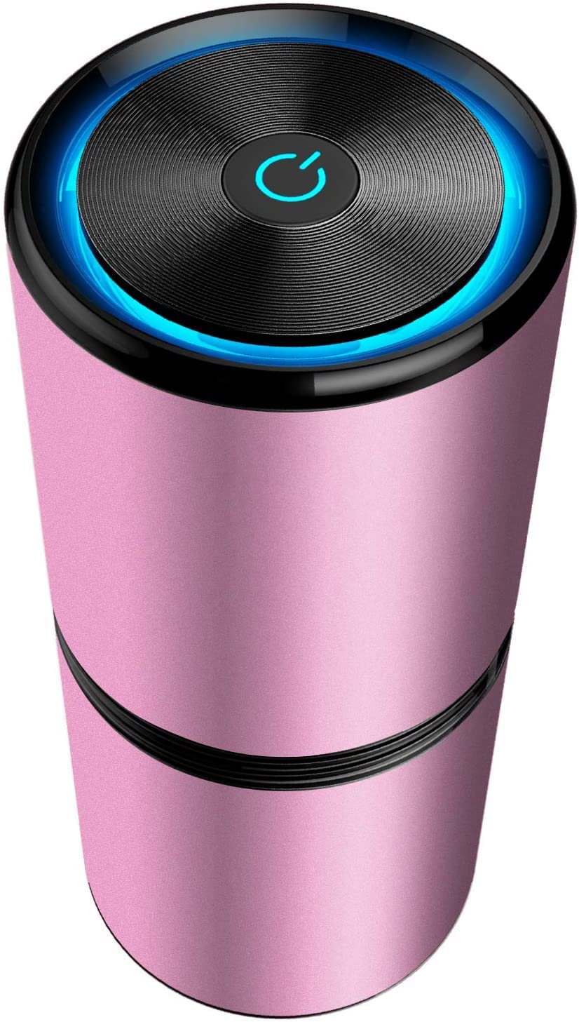 Umidificatore portatile rosa con design cilindrico, pulsante di accensione illuminato, ideale per casa e ufficio. Accessorio elegante e funzionale.