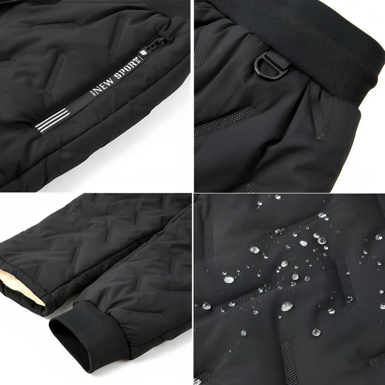 Giacca sportiva nera impermeabile, dettagliata con cerniera, polsini elasticizzati e tessuto resistente all'acqua. Ideale per attività all'aperto.