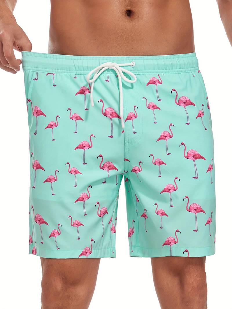 Costume da bagno uomo verde menta con stampa fenicotteri rosa, laccio in vita. Design estivo, moda mare, abbigliamento da spiaggia.