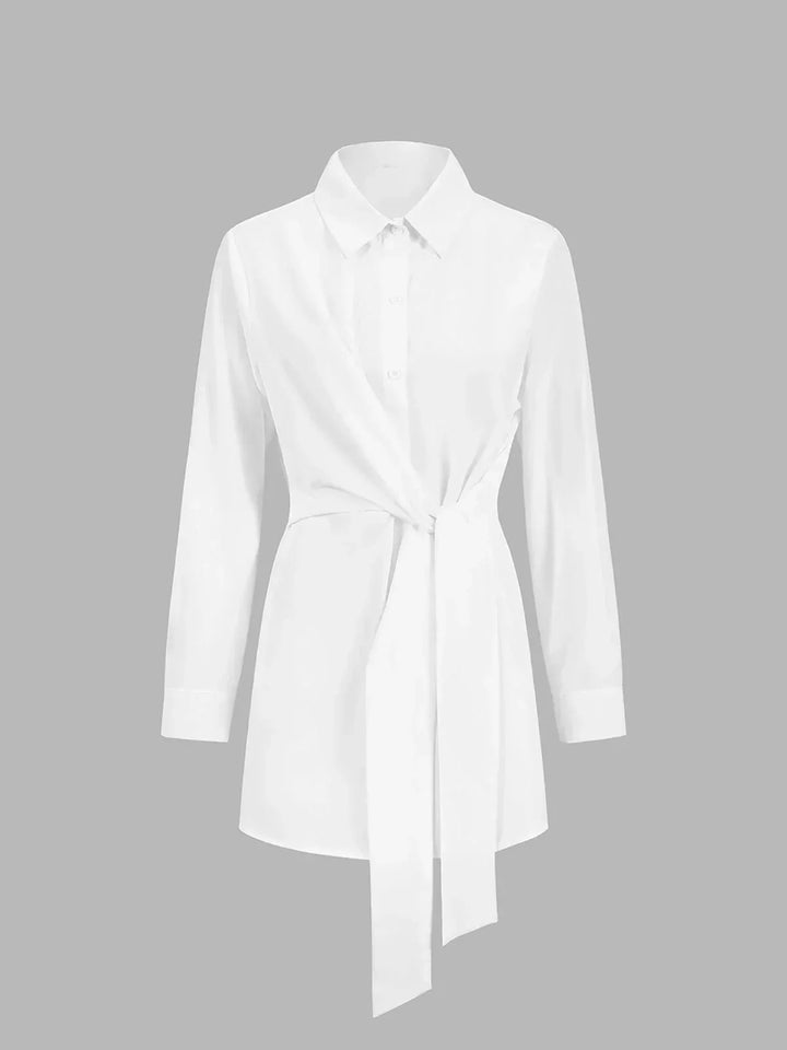 Blouse femme en coton léger, nouée devant avec manches boutonnées, idéale pour un style décontracté et élégant.