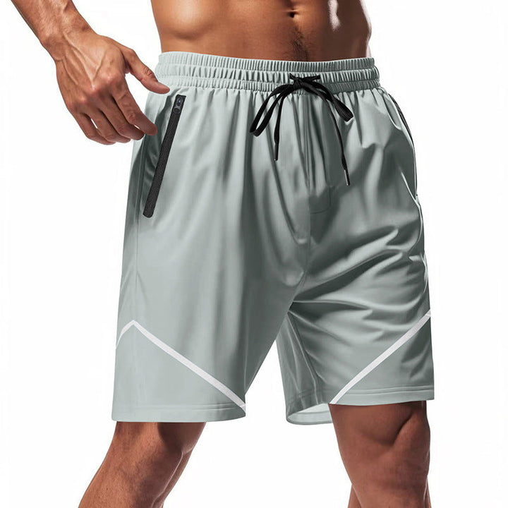 Shorts sportivi grigi da uomo con tasche con zip, elastico in vita e dettagli bianchi. Ideali per allenamento, palestra e corsa.