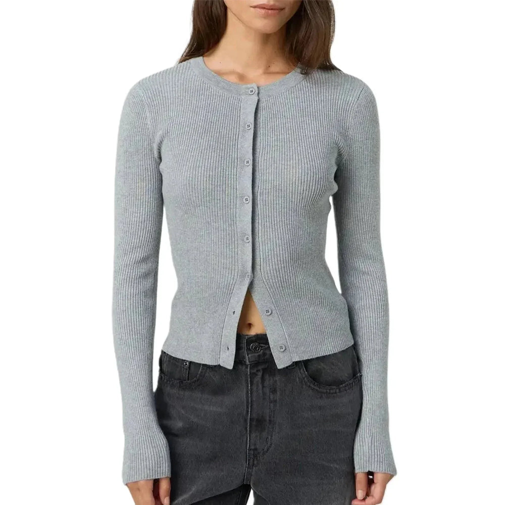 Cardigan femme ajusté jaune à manches longues côtelées en matière douce et extensible.