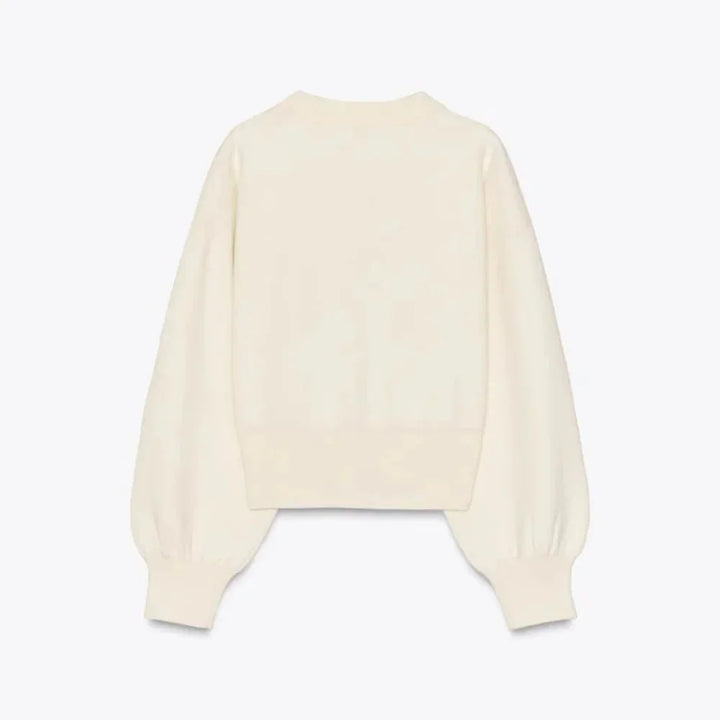 Cardigan crème à manches longues, boutons stylés, en matière douce, coupe classique pour femme.