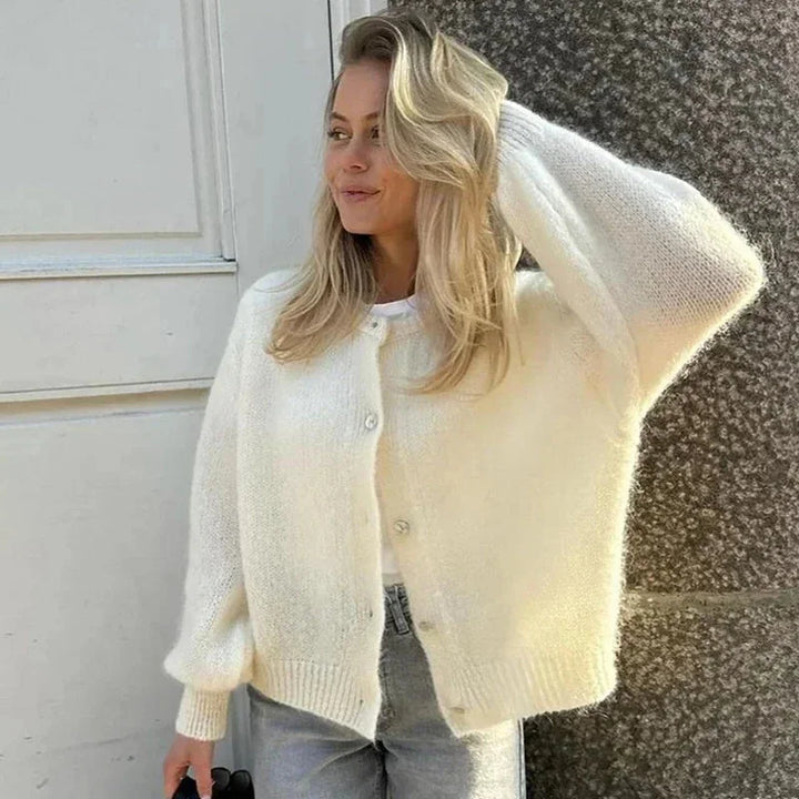 Cardigan femme à manches bouffantes, motif léopard, en tissu doux, adapté pour des tenues décontractées.