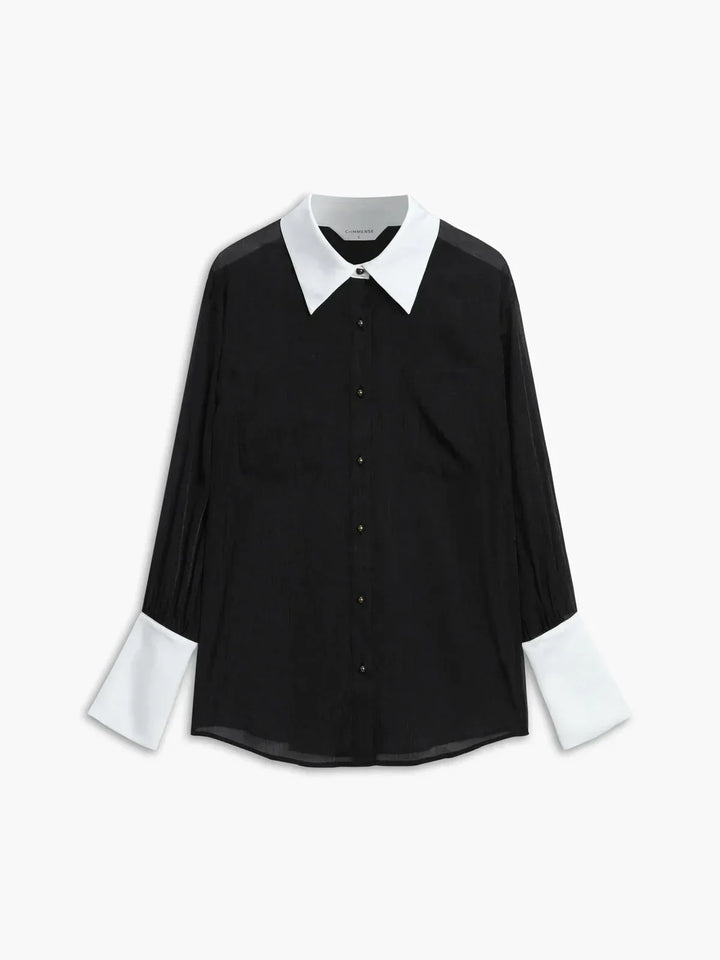 Chemisier femme noir transparent avec boutons, col élégant, en tissu léger et fluide, parfait pour un look chic et féminin.