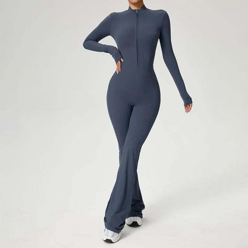 Combinaison de yoga bleue pour femme, manches longues, avec zip, en tissu respirant et élastique.