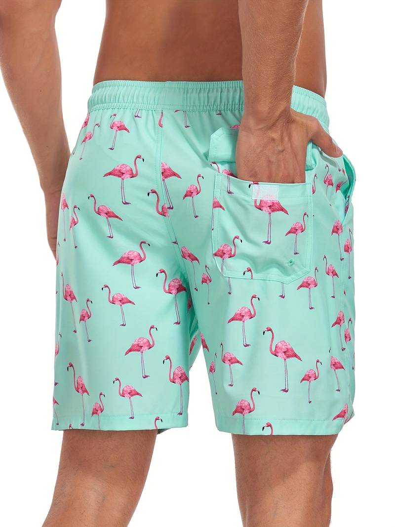 Pantaloncini da bagno uomo verde menta con stampa fenicotteri rosa, tasca posteriore, elastico in vita. Costume mare estivo moda uomo.