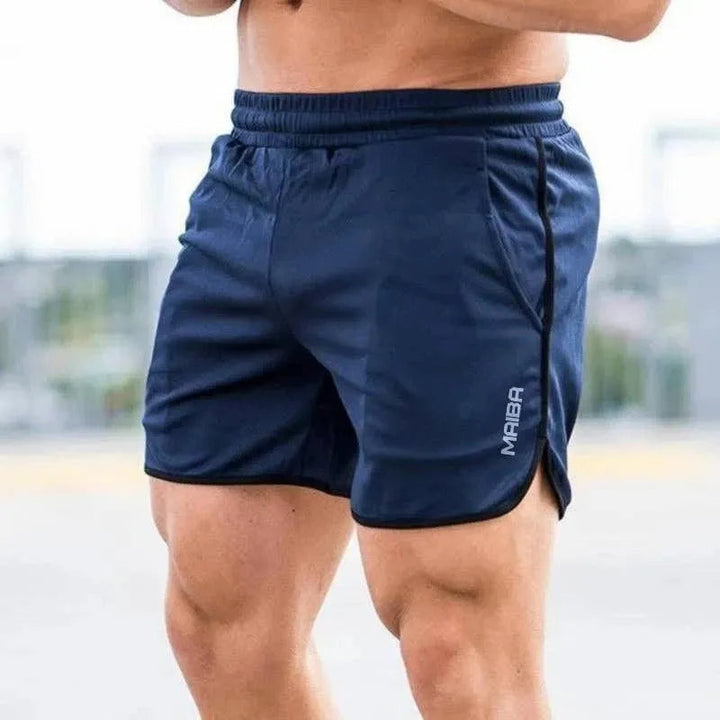 Shorts sportivi blu scuro da uomo, elastico in vita, marchio "Mamba" visibile, ideali per palestra e fitness.