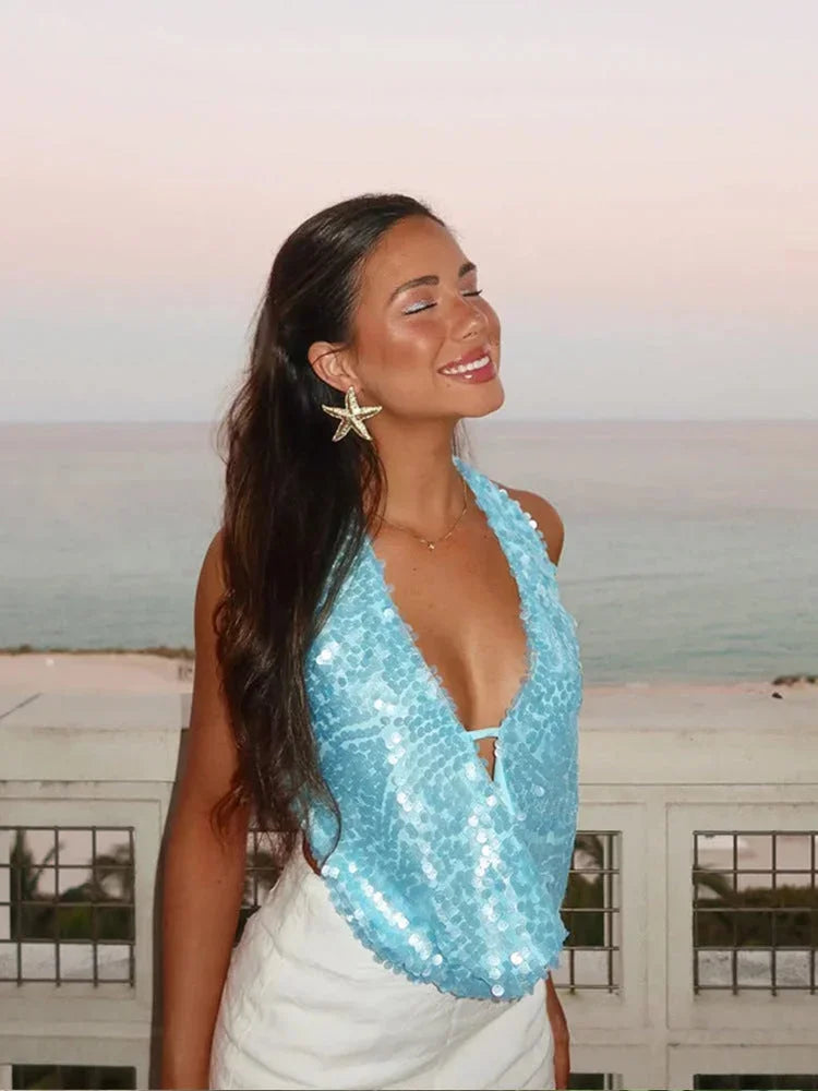Débardeur femme en polyester avec sequins brillants et col halter, idéal pour des soirées élégantes ou des événements…